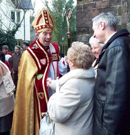 Greeting the Bishop after his installation